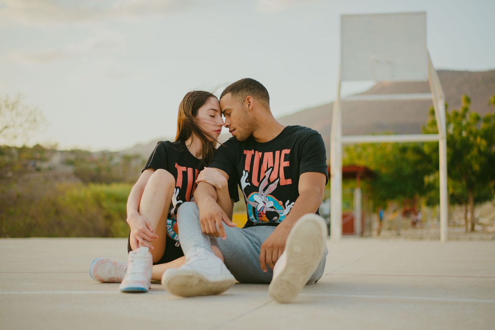 man and woman posing in matching tshirts