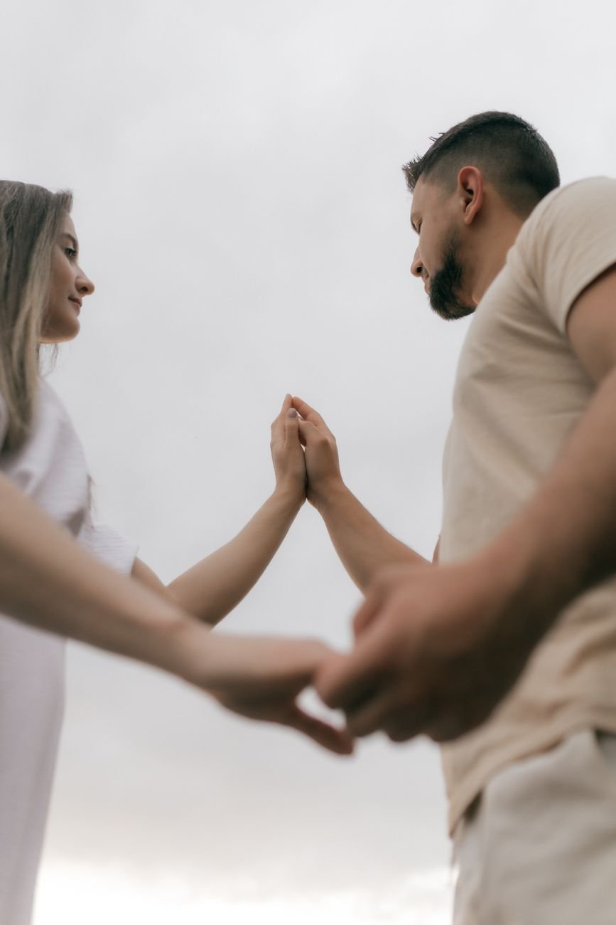 romantic couple holding hands outdoors