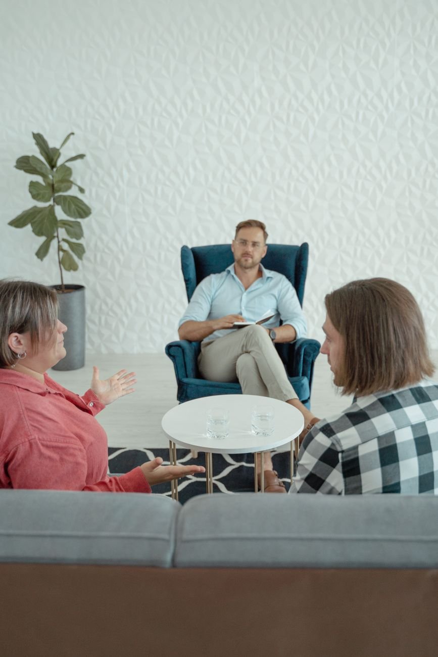 a counselor counseling a couple