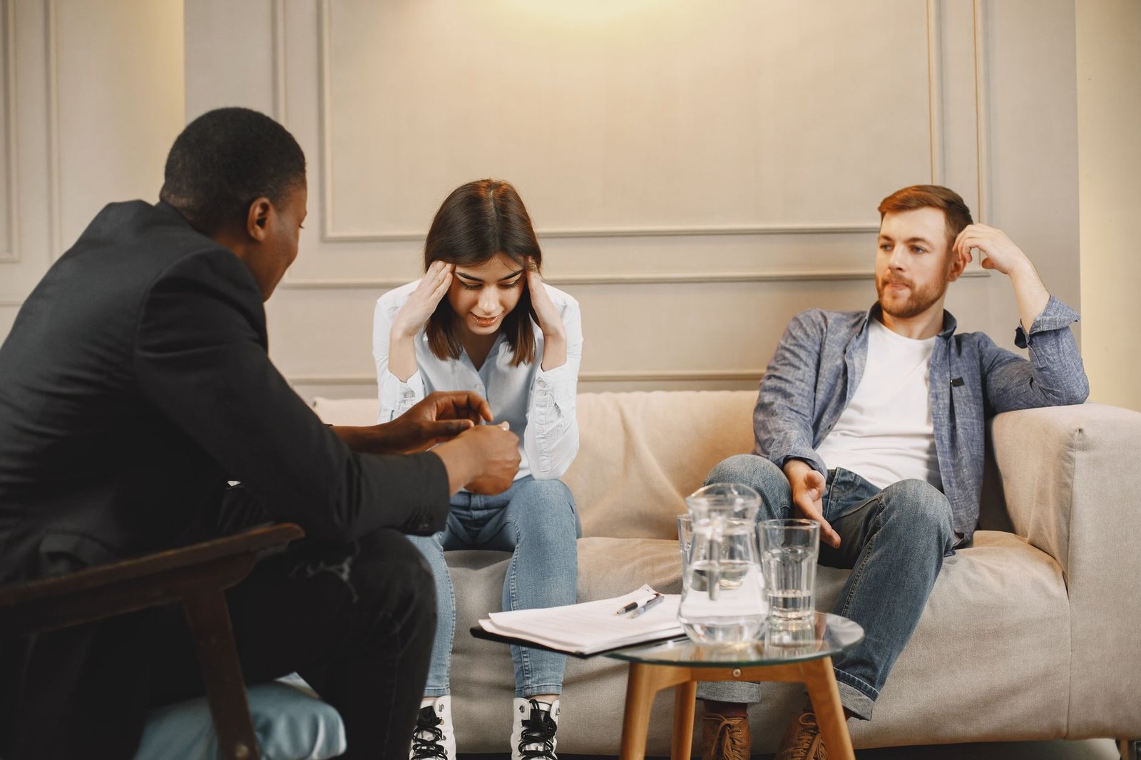 couple sitting on couch in therapist office