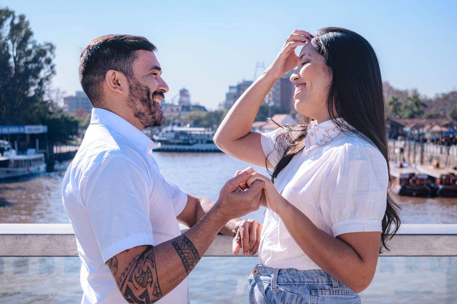 romantic couple laughing by river in tigre